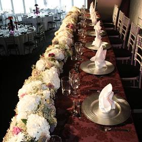 fwthumbFull length top table display of hydrangea, roses & gypsophilia.jpg